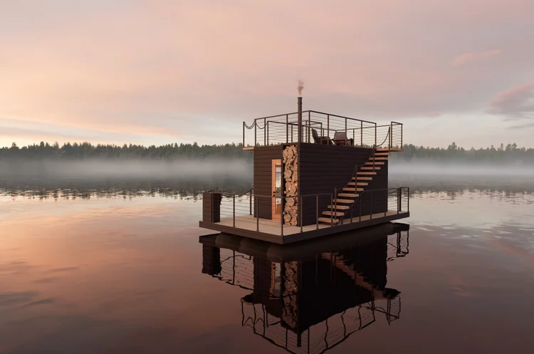 Warm cedar sauna interior with bench seating and lake light